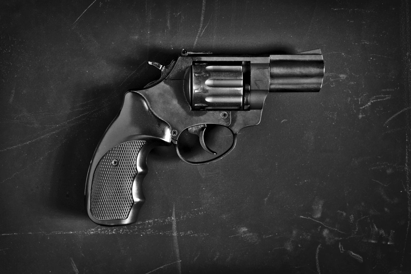 Stock photo, illustrative. A revolver on a dark surface.